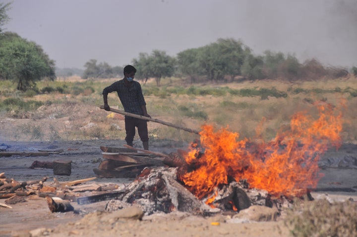 A crematorium worker cremates the body of a victim who died from the coronavirus on April 27.