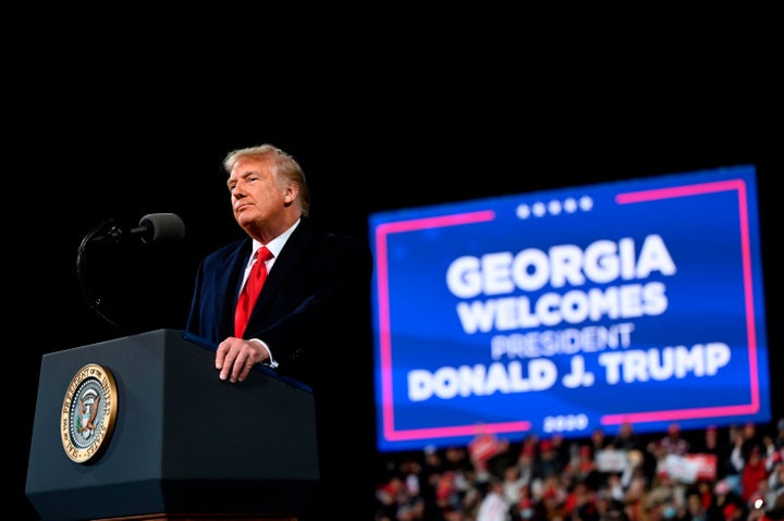 Donald Trump speaks at a rally to support Republican Senate candidates at Valdosta Regional Airport in Valdosta, Georgia on D