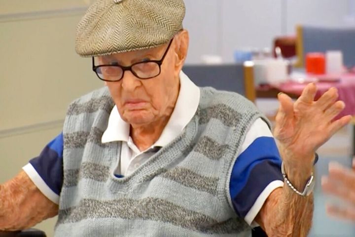Australia's Dexter Kruger gestures at a nursing home in the rural Queensland state town of Roma, Australia on May 13, 2021. Kruger, Australiaâs oldest-ever man, has included eating chicken brains among his secrets to living more than 111 years. The retired cattle rancher on Monday, May 17, 2021, marked 124 days since he turned 111, a day older than World War I veteran Jack Lockett was when he died in 2002. (Australian Broadcasting Corporation via AP)