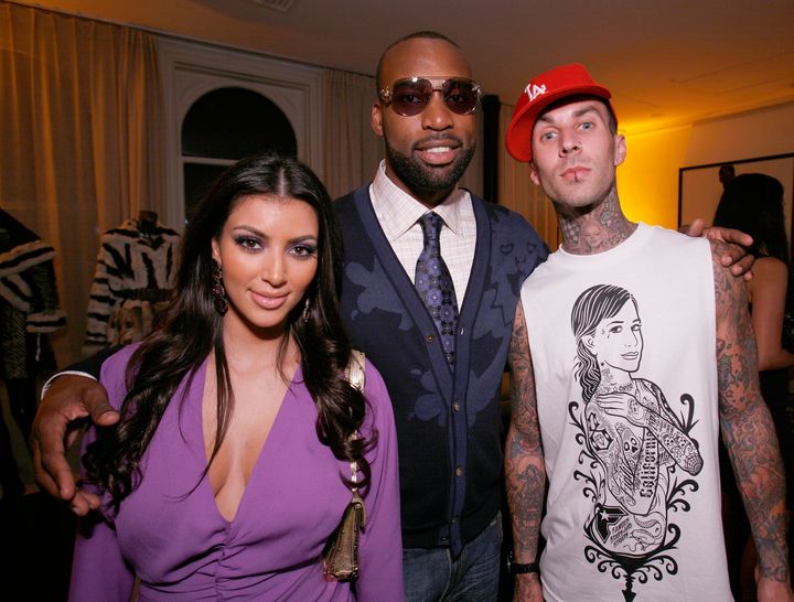 Kim Kardashian (left) and Travis Barker (right) pictured together in 2007 with Baron Davis.