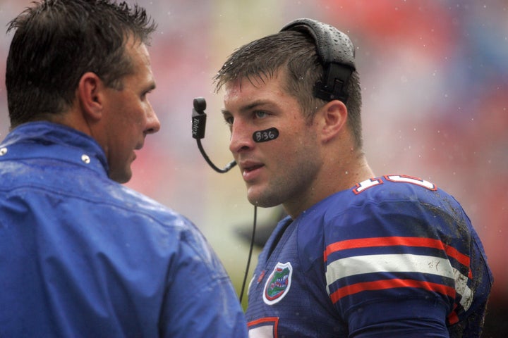 Florida coach Urban Meyer chats with quarterback Tim Tebow on the sidelines in 2009.