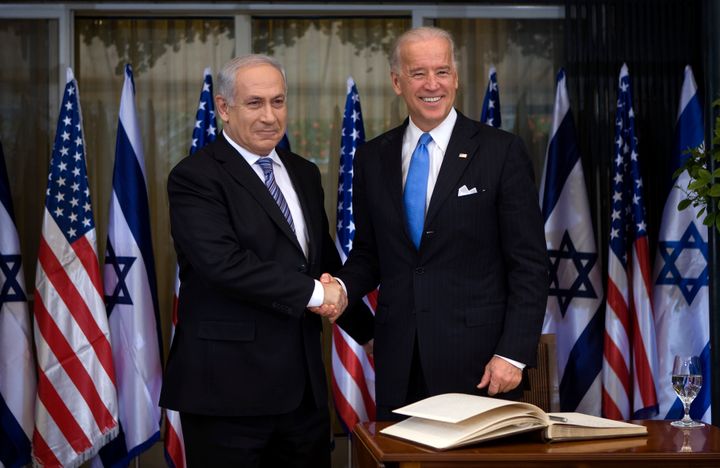 President Joe Biden, right, greets Israeli Prime Minister Benjamin Netanyahu in March 2010. Some U.S. foreign policy hands are skeptical that threatening to withhold aid will work this time.
