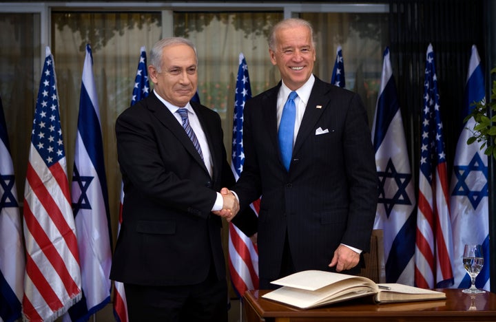 President Joe Biden, right, greets Israeli Prime Minister Benjamin Netanyahu in March 2010. Some U.S. foreign policy hands are skeptical that threatening to withhold aid will work this time.