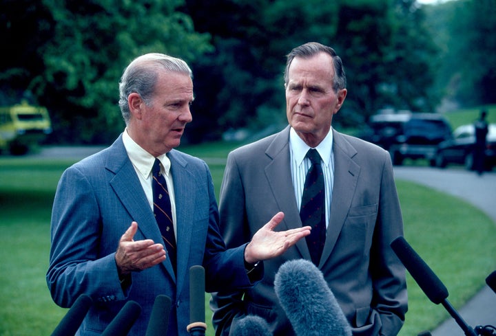 Secretary of State James A. Baker III and President George H.W. Bush speak to the press in May 1991. After the first Gulf War, Bush sought to achieve Palestinian-Israeli peace.