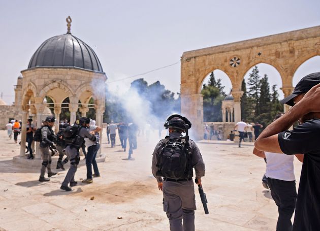 Israeli security forces and Palestinian Muslim worshippers clash in Jerusalem's al-Aqsa mosque compound,...