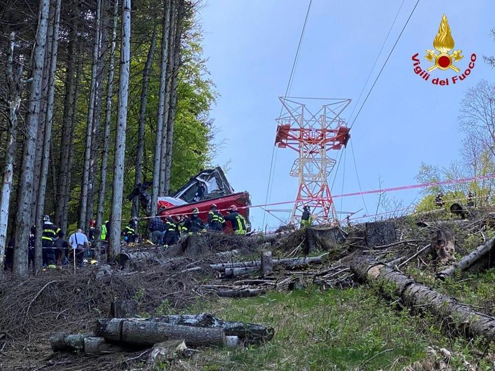 Italian fire fighters are seen near the crashed cable car after it fell from the Stresa-Alpine-Mottarone line near Lake Maggiore in Stresa, Italy on May 23, 2021. (Photo by Italian Fire Department/Handout/Anadolu Agency via Getty Images)
