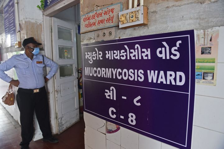 A security guard stands at the entrance of a ward for people infected with Black Fungus or scientifically known as Mucormycosis, a deadly fungal infection, at a civil hospital in Ahmedabad on May 23, 2021. (Photo by Sam PANTHAKY / AFP) (Photo by SAM PANTHAKY/AFP via Getty Images)