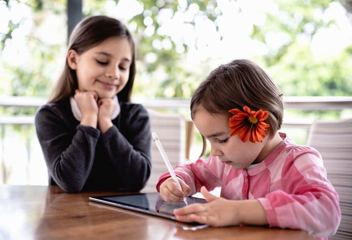 Children Drawing Pictures Using Digital Tablet