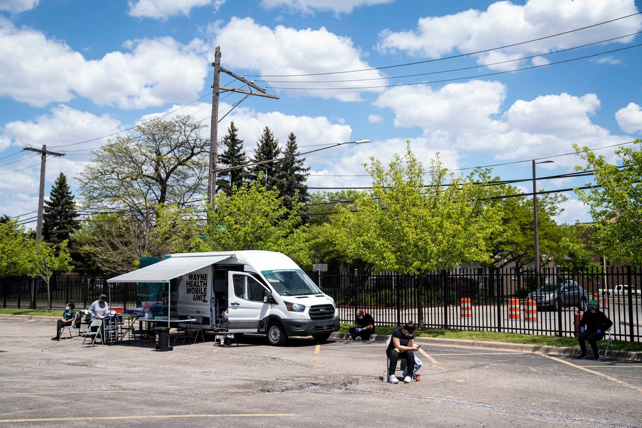 Staff wait for patients who want a COVID-19 vaccine at one of the Wayne Health Mobile Units in Detroit, May 14, 2021. On this day, the unit only administered two doses, as opposed to the normal numbers of about 200 a day.