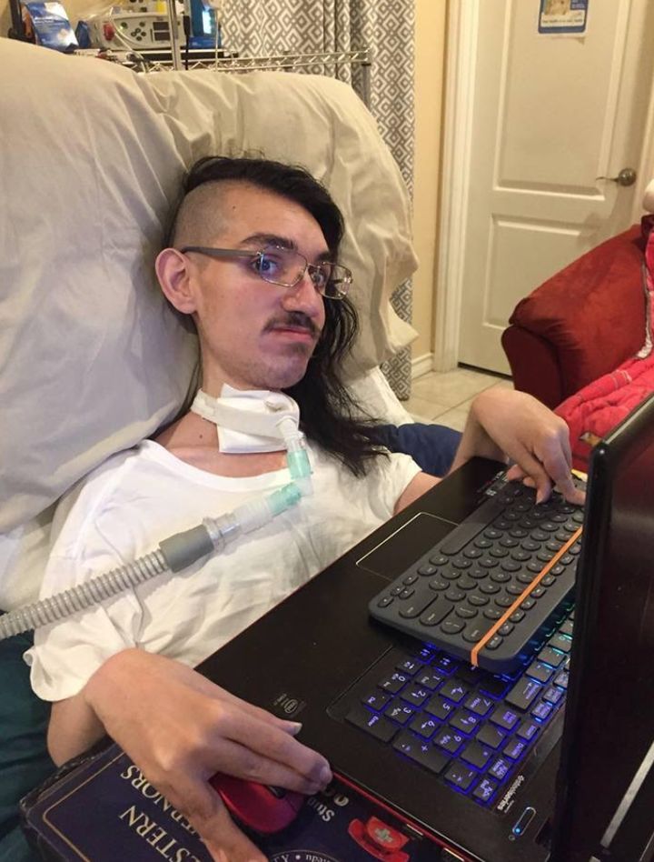 Gabe with his new computer (August 2018).
