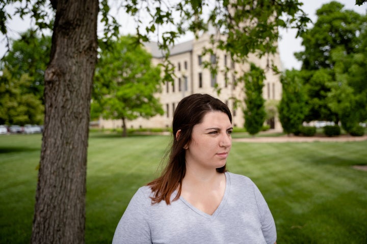 Madison Smith stands in front of the McPherson County Courthouse in McPherson, Kansas, in this undated photo. (Photo by Chris