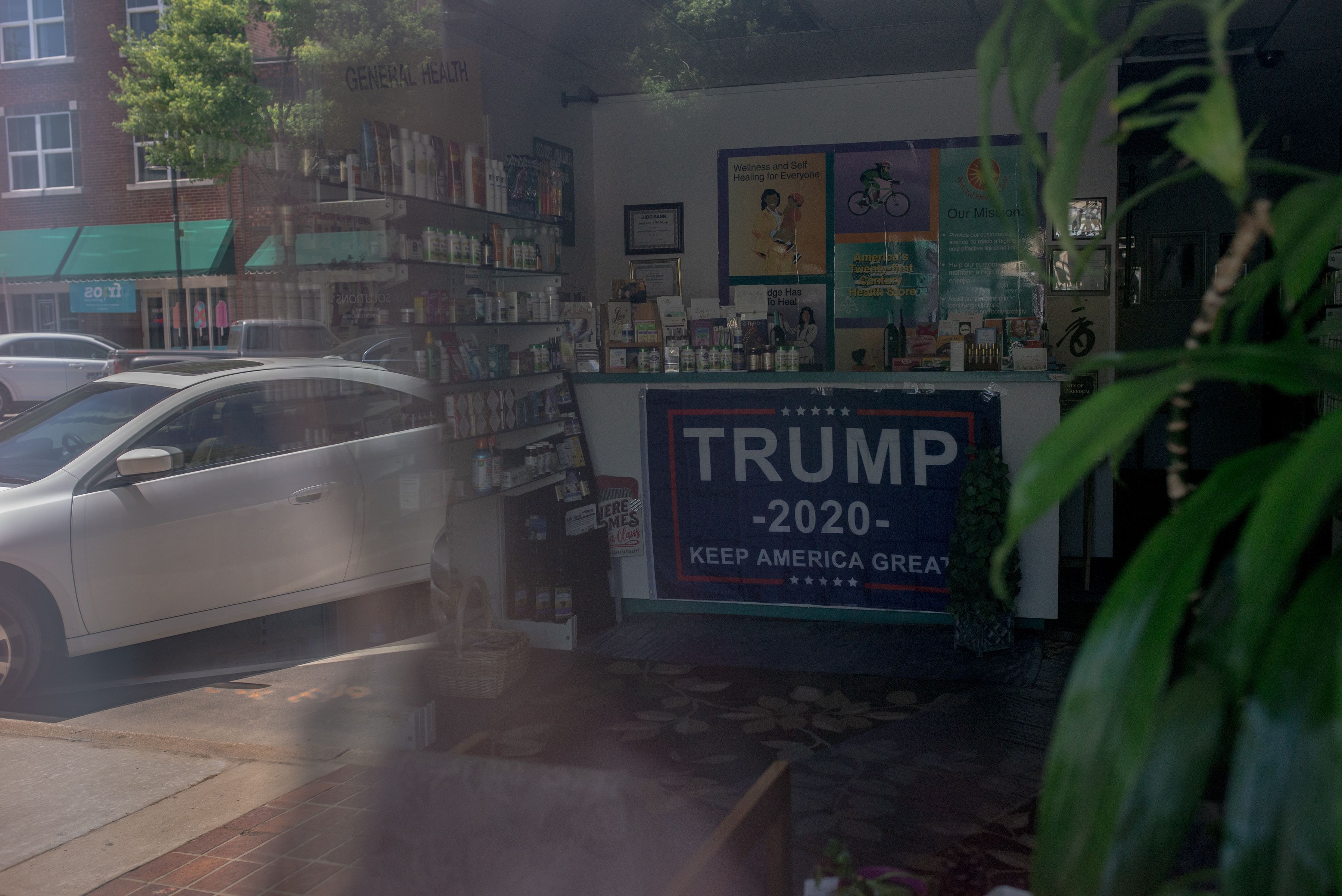 A Trump banner hangs on the front desk of Natural Health Clinic, located on Black Wall Street.