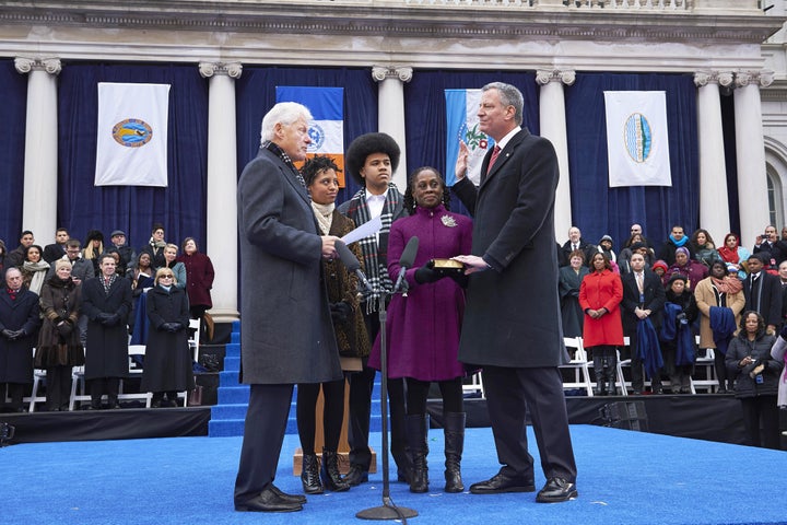 New York City Mayor Bill de Blasio, right, takes the oath of office in 2014. Progressives rejoiced at de Blasio's election, but now say that his tenure has undermined the left.