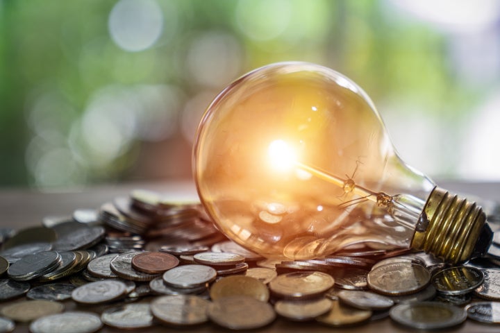 Light bulb with coin