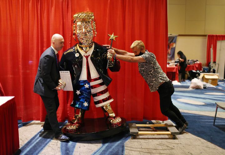 Republicans roll out a golden statue of Donald Trump ahead of his speech to the Conservative Political Action Convention, one month before the insurrection.