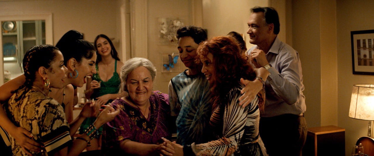 Daphne Rubin-Vega as Daniela (from left), Stephanie Beatriz as Carla, Melissa Barrera as Vanessa, Olga Merediz as Abuela Claudia, Gregory Dias IV as Sonny, Dascha Polanco as Cuca and Jimmy Smits as Kevin Rosario in "In the Heights."