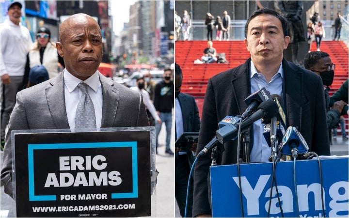 Eric Adams, left, and Andrew Yang held dueling press conferences in Times Square the day after three tourists were shot. Crime has become the central issue in New York's mayoral race.