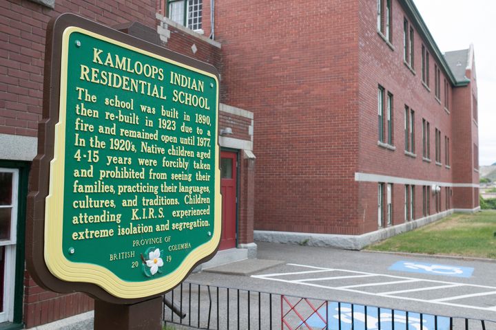 A plaque is seen outside of the former Kamloops Indian Residential School on Tk'emlups te Secwépemc First Nation in Kamloops, British Columbia, Canada on Thursday, May 27, 2021. (Andrew Snucins/The Canadian Press via AP)