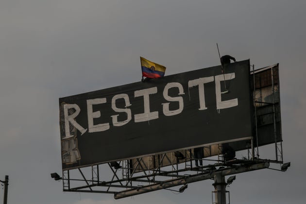 BOGOTA, COLOMBIA - MAY 29: Protesters perform in front of the Portal de las Americas station, rename as 