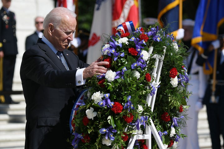 President Joe Biden takes part in a wreath-laying in front of Tomb of the Unknown Soldier at Arlington National Cemetery on M