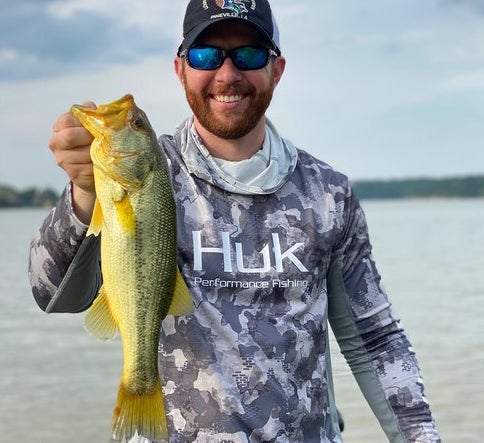 Josh Rogers landed a rare golden-hued largemouth bass.