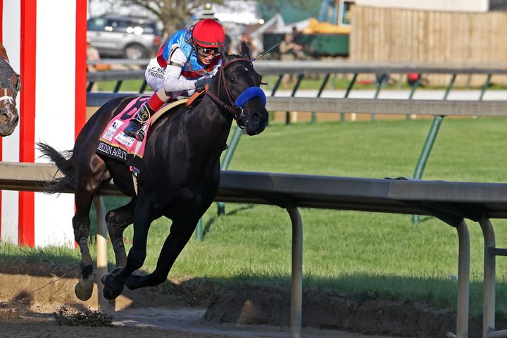 Medina Spirit ridden by John Velasquez leads the Kentucky Derby en route to victory in the May 1 Triple Crown race. But the triumph came closer to being overturned after the horse failed another drug test.