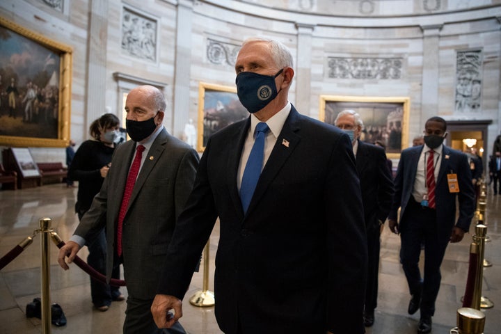 Vice President Mike Pence makes his way to the House floor for a joint session of Congress to tally the Electoral College vot