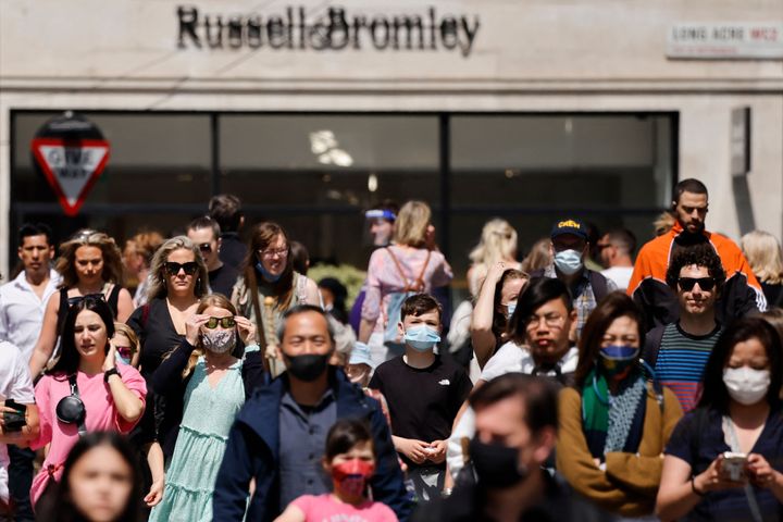 People walk through Covent Garden in central London on June 3, 2021.