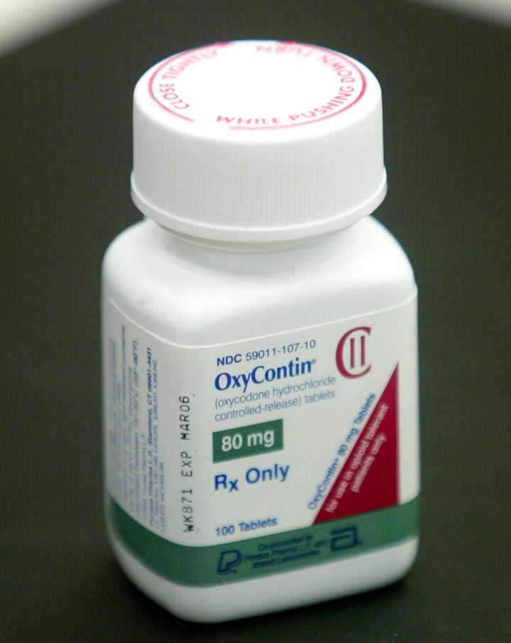 A bottle of OxyContin is seen on a pharmacy counter. Purdue has generated more than $30 billion since bringing the addic