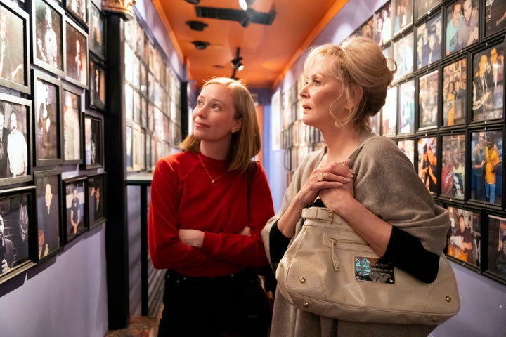 Ava (Hannah Einbinder) (left) and Deborah (Jean Smart) (right) looking at an old photo of Deborah on the wall at a comedy club, in a scene from the HBO Max comedy series "Hacks."