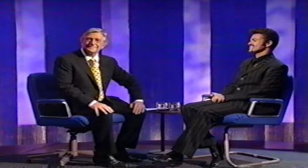 George Michael sitting with Michael Parkinson in 1998