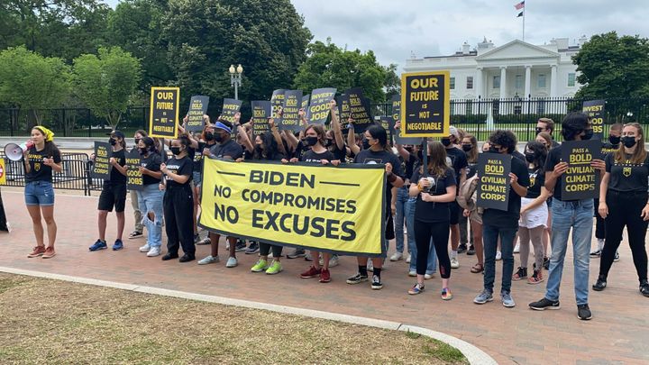 Sunrise Movement protesters gather outside the White House on Friday to protest the Biden administration.
