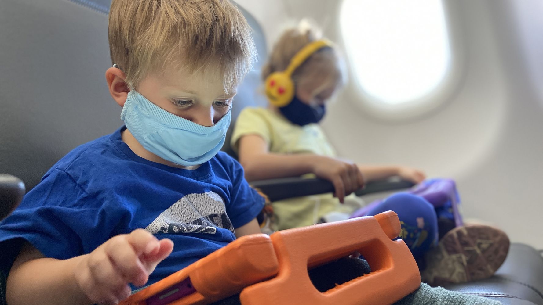How to Entertain a 2 Year Old on a Plane + Tips for Flying with a Toddler -  Speak. Play. Love.
