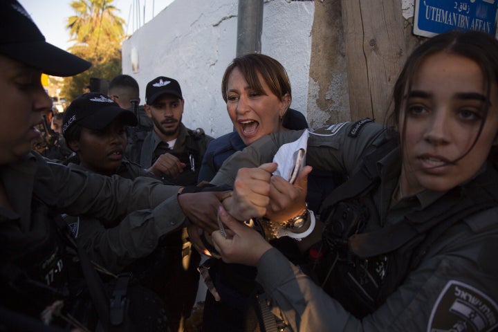 JERUSALEM - JUNE 05: Al Jazeera journalist Givara Budeiri is being taken into custody by Israeli police while she was covering a sitting protest Israel's decision to evict Palestinian families in Sheikh Jarrah neighborhood in Jerusalem on June 05, 2021. (Photo by Faiz Abu Rmeleh/Anadolu Agency via Getty Images)