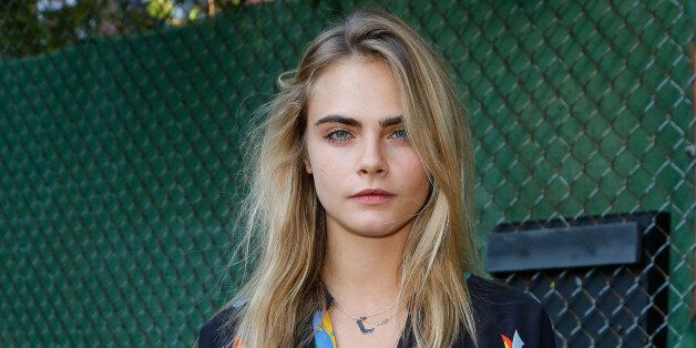 NEW YORK, NY - JUNE 05: Cara Delevingne attends the Stella McCartney Spring 2015 Presentation at Elizabeth Street Gardens on June 5, 2014 in New York City. (Photo by JP Yim/Getty Images)