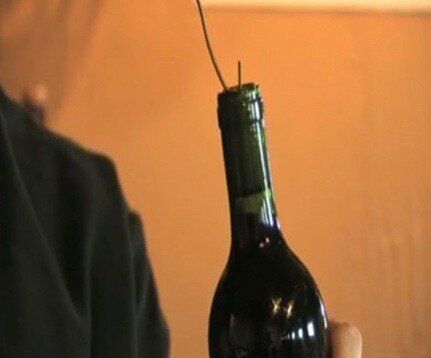 4 Ways to Open a Wine Bottle Without a Corkscrew, According to Wine Experts