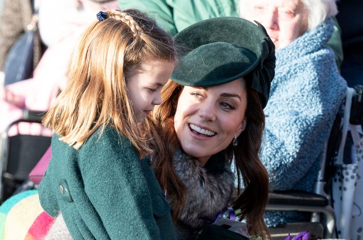 Princess Charlotte with her mother, Kate Middleton, at a Christmas Day service in 2019.