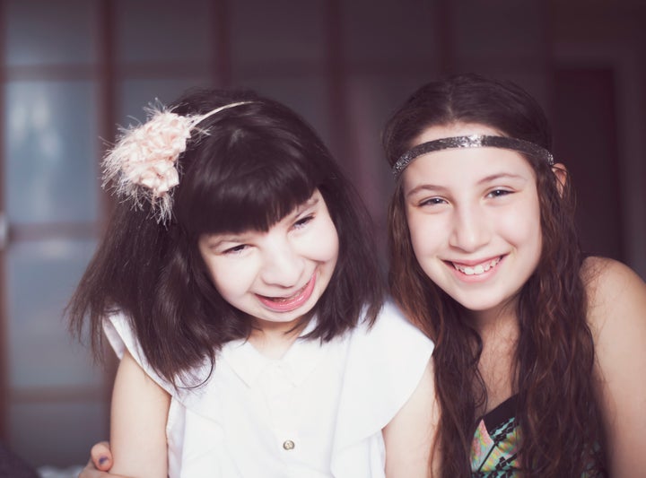 Emma (left), on her 16th birthday, with her sister Hanna (then 12 years old).