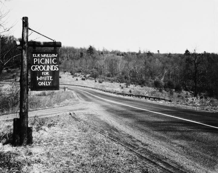 A sign at Elkwallow Picnic Grounds in Shenandoah National Park, Virginia, reads "Picnic grounds for white only" in 1940. After reconstruction, laws allowing segregation were formed. This system became known as Jim Crow.