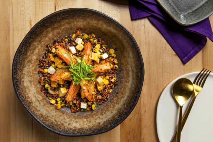 Chica's “Grilled Shrimp and Quinoa” with beluga lentils, queso fresco, fire-roasted corn, chile poblano and purple potato sofrito.