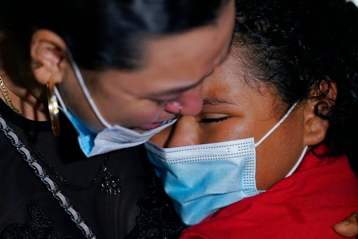 Emely, right, is reunited with her mother, Glenda Valdez at Austin-Bergstrom International Airport, Sunday, June 6, 2021, in Austin, Texas. It had been six years since Valdez said goodbye to her daughter Emely in Honduras. Then, last month, she caught a glimpse of a televised Associated Press photo of a little girl in a red hoodie and knew that Emely had made the trip alone into the United States. On Sunday, the child was returned to her motherâs custody. (AP Photo/Eric Gay)