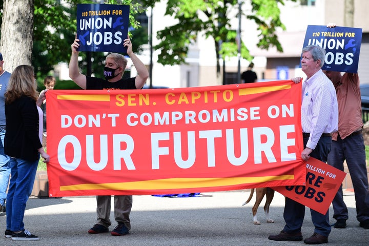 Community members gather outside of Senator Shelley Moore Capito's office as West Virginians in Charleston call for an investment in care, climate, and families on June 3.