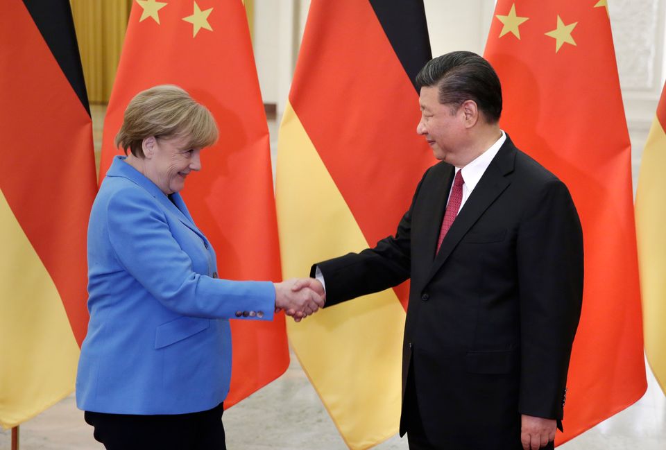 BEIJING, CHINA - MAY 24: China's President Xi Jinping (R) meets German Chancellor Angela Merkel at the...