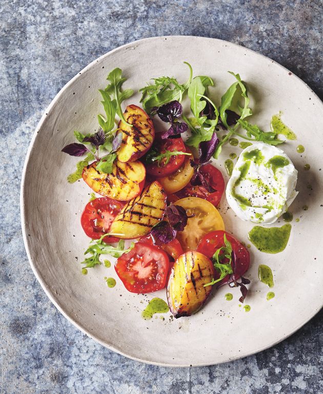 Tomato and chargrilled peach salad with buffalo mozzarella and basil-oil dressing.