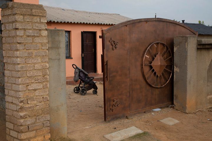 A pram stands outside the home of Gosiame Thamara Sithole in Tembisa, near Johannesburg, Thursday, June 10, 2021. South Africa is gripped by a mystery over if the woman, Sithole, has, as has been claimed, given birth to 10 babies in what would be a world-first case of decuplets. The South African government said Thursday it is still trying to verify the claim. (AP Photo/Denis Farrell)