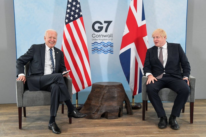 Britain's Prime Minister Boris Johnson (R) and US President Joe Biden pose before a bilateral meeting at Carbis Bay, Cornwall