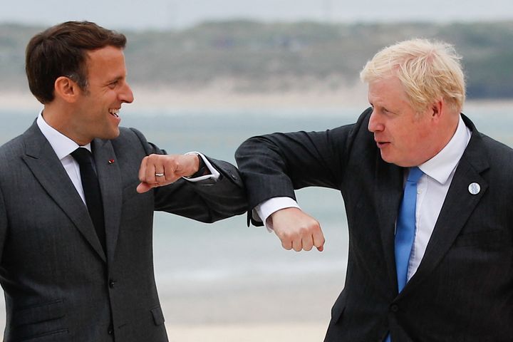 Boris Johnson greets French president Emmanuel Macron at the G7 summit on Friday