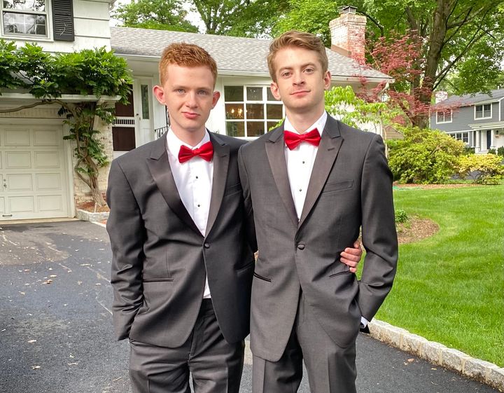 The author's sons, Jonah (right) and Ian (left), poses for prom pictures on their front lawn.