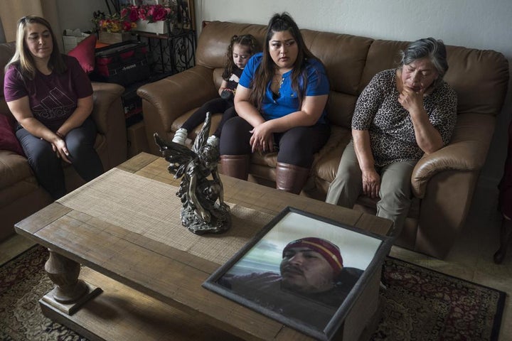 Family members of Jerry Ramos become emotional when looking at a photo of him at the family home in Watsonville, Calif., Sunday, June 6, 2021.