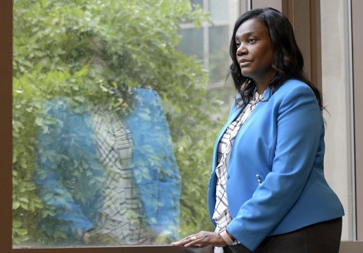 Yolanda Ogbolu, a nurse researcher at the University of Maryland, Baltimore, who advocated for two relatives during their COVID-19 hospital stays, looks out a window at the university's nursing school on Friday, June 11, 2021, in Baltimore.